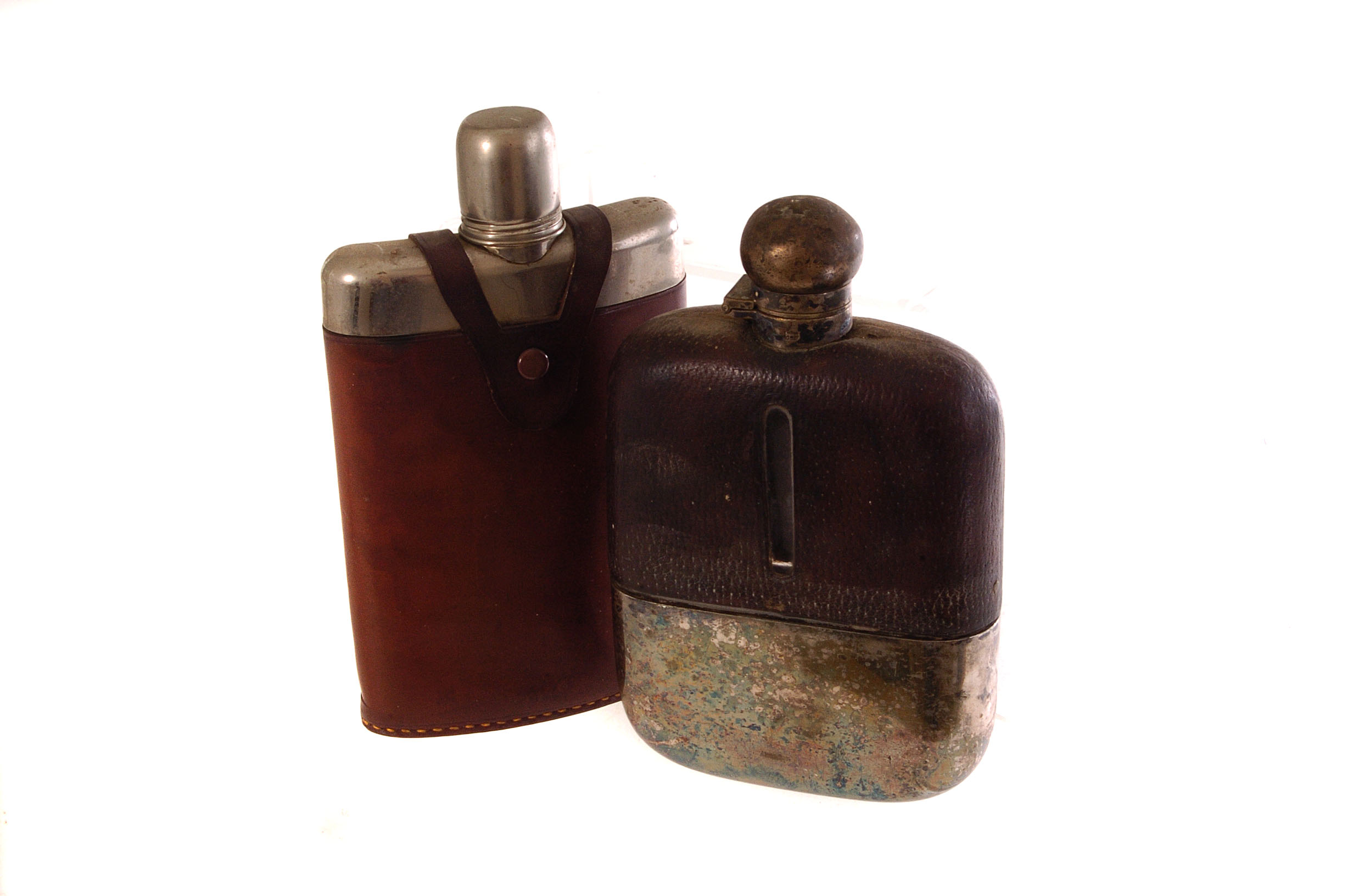 A silver plated and leather hip flask, together with another similar (2)