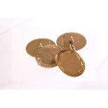 A pair of 9ct gold oval cufflinks, with engraved design, linked by a chain, approx 4.6g