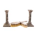 A pair of EPBM candlesticks by James Dixon & Son, in the form of columns, decorated with swags,