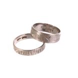 Two platinum bands, both with different engraved design, approx 9.4g, sizes O and P (2)