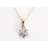 A 9ct gold and tanzanite pendant, the cluster mount set with seven light blue round cut stones,