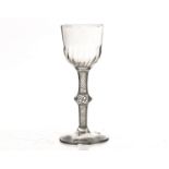 An 18th century wine glass, with bassily writhen bowl on a knopped multi cotton twist stem, on a