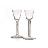 Two 18th century wine glasses, one with plain funnel bowl on fine double cotton twist stem, plus