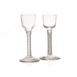 Two 18th century wine glasses, with plain funnel bowls, one with fine double helix cotton twist