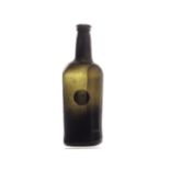 An early 19th century green sealed wine bottle, of shouldered cylindrical form with kick-up base and