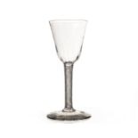 An 18th century wine glass, this large form glass with bassily writhen bowl, and spiral air twist