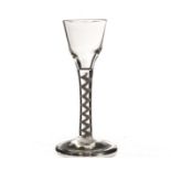 An 18th century wine glass, with ogee bowl on a cotton twist stem, on a plain foot 15.5cm H