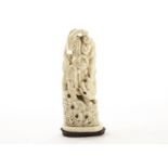 A 19th century Tokyo school carved ivory figural group, the late Meiji period group carved as a