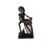 An unusual Vietnamese root carved figure, modelled as a fisherman stood casting his net, approx 45.