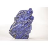 A large sample of lapis lazuli, the naturally shaped polished piece of blue hardstone weighing