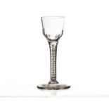 An 18th century wine glass, with bassily writhen bowl on cotton twist stem, and plain foot 14.5cm H