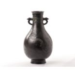 A Chinese bronze vase of archaic form, the pear shaped body with cloisonné inlaid dragon decoration,