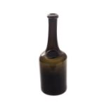 A 19th century green/brown glass bottle, of long neck cylindrical form with kick-base, and with