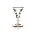 An 18th century cordial glass, with deceptive bowl supported on knopped stem to plain foot 9cm H