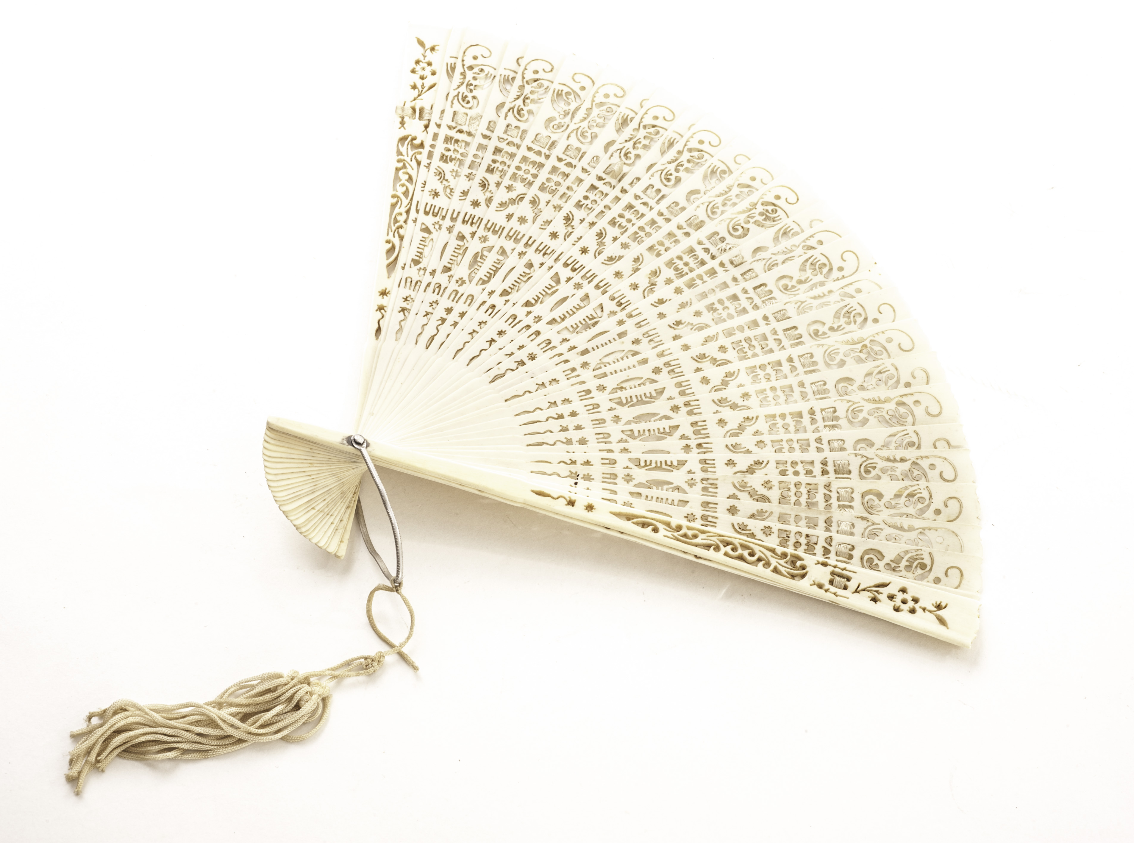 A 19th century Chinese ivory fan, having pierced designs to tapered stems