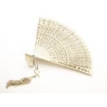 A 19th century Chinese ivory fan, having pierced designs to tapered stems