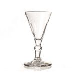 An 18th century wine glass, with bassily writhen bowl on a knopped stem on a plain foot 11cm