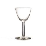 A 19th century wine glass, with bassily dimpled bowl. The hexagonal red, white, and blue core,