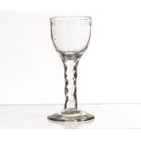 An 18th century cordial glass, the bowl with lapidary cut edge decoration on faceted stem to a plain