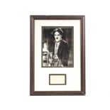 Autograph, Charlie Chaplin: Framed and Glazed paper sheet signed ‘Charlie Chaplin’, mounted