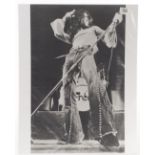 Free: A large original photo­graph of Paul Rodgers of Free taken during live performance circa