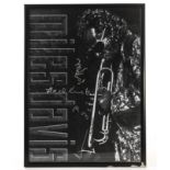 Miles Davis: Framed and glazed poster signed in silver pen ‘Good Luck Ron Miles’, the poster was a