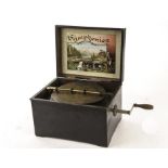 Symphonion: a 758-inch Symph­onion disc musical box, crank wound, in grained case with polychrome