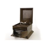 Table grand gramophone: a Carolphone, with metal internal horn enclosed by doors, in oak case