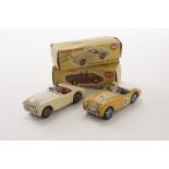 A Dinky Toys 109 Austin Healey 100 Sports, competition finish, deep yellow body, blue interior and