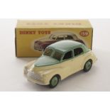 A Dinky Toys 159 Morris Oxford Saloon, cream lower body, green upper body and hubs, in original box,