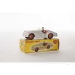 A Dinky Toys 105 Triumph TR2 Sports, grey body, red interior and hubs, in original box, E, small