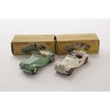 A Dinky Toys 102 MG Midget, touring finish, pale green body, cream interior and hubs, 108 MG