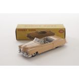 A Dinky Toys 131 Cadillac Tourer, salmon pink body, grey interior, beige ridged hubs, in original