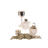 A collection of silver and silver plated items, to include cut glass scent bottles, belts, a serving