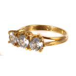 A 9ct gold and three stone aqua dress ring, the three round cut stones in parallel, set in claw