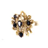 An 18K gold, sapphire random 'twig' set cluster ring, having bark patterning to gold with five