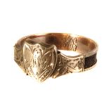 A 19th century gold and woven hair signet ring, having momento mori shield shape to from and woven