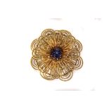 An 18K marked Italian gold and sapphire chrysanthemum brooch, comprising of four corded wire