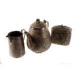 A collection of Indian silver items, including a casket, a jug and teapot, all with each with