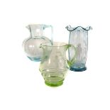 A Mary Gregory green glass water jug, together with a blue glass water jug and vase, of Mary Gregory