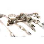 A collection of 15 silver tongs, including some Georgian examples, some with swag design, approx