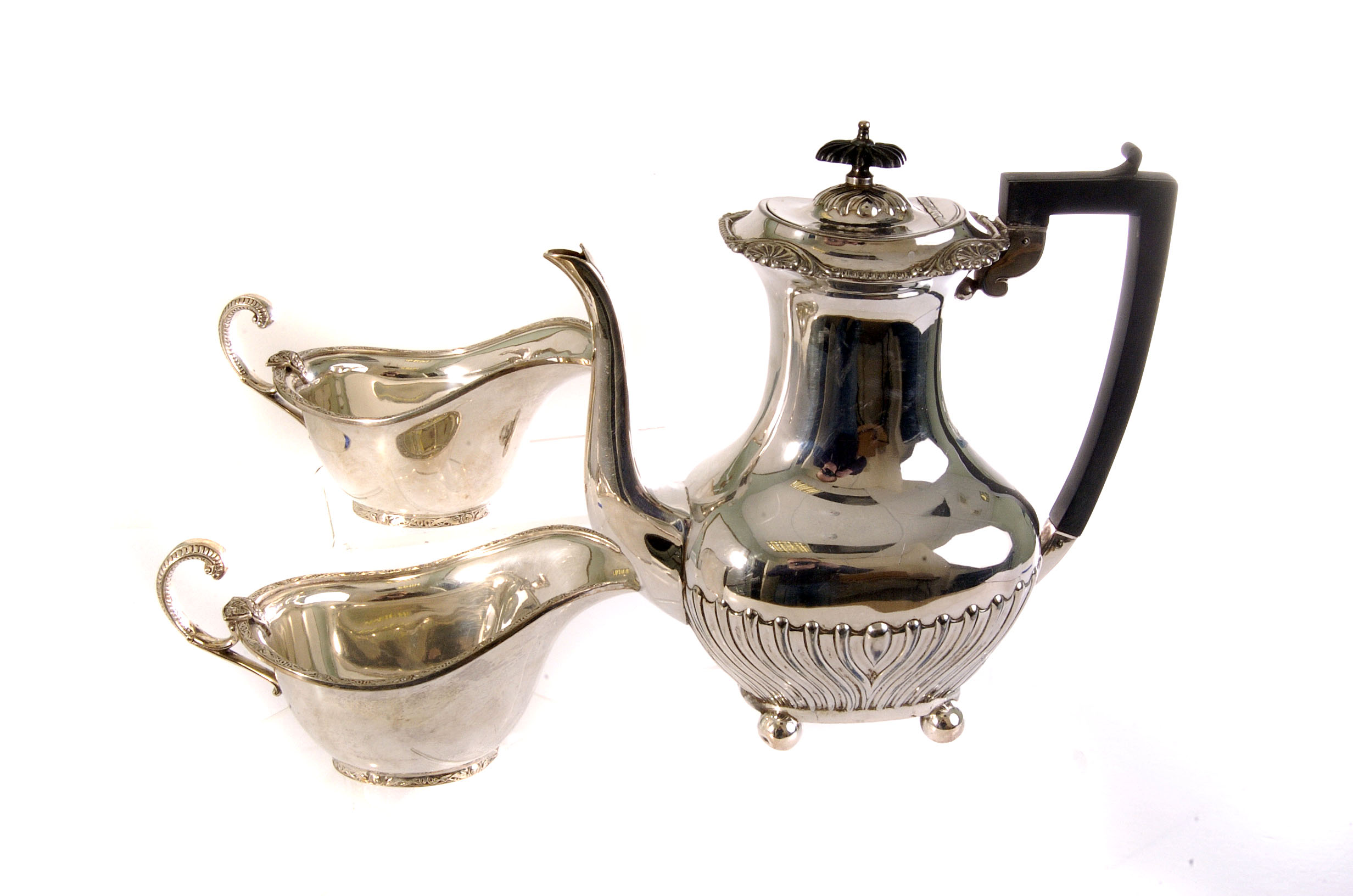 A collection of silver and silver plated items, to include a candelabra, milk jugs, coffee pot and