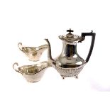 A collection of silver and silver plated items, to include a candelabra, milk jugs, coffee pot and