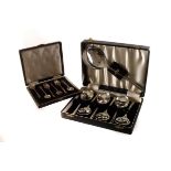 A cased set of George V silver back dressing table items, together with a cased set of six silver