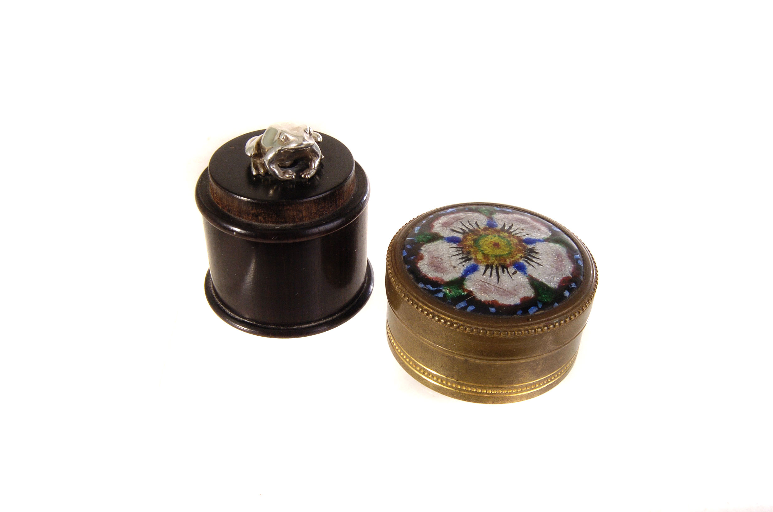 A wooden circular box having silver frog figure to lid, together with an enamelled box with floral