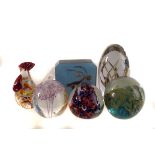 A collection of glass and resin paperweights, including Strathearn, Guernsey glass and others, all