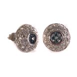 A pair of 9ct gold colourless and teal diamond earrings, the round shaped earrings having four round