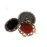 A gold and carnelian hardstone brooch, the oval carnelian in pierced 'man in the moon' crescent