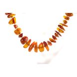 A graduated single string bead necklace, the un-uniformed beads forming a 71cm long necklace, approx
