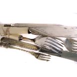 A collection of silver and plated flatware, including mother of pearl handle pickle forks, fork sets